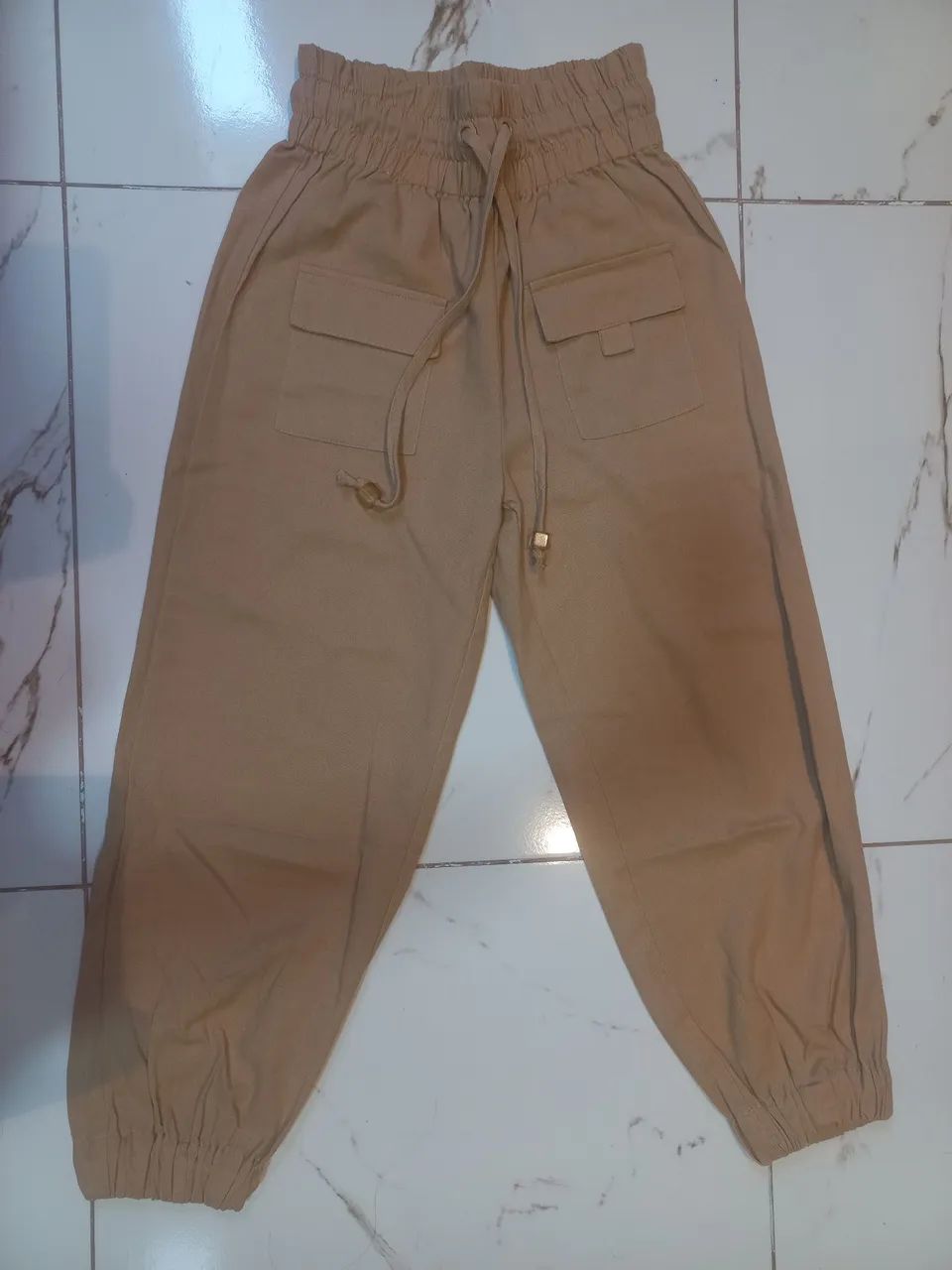 Calça bege Riachuelo