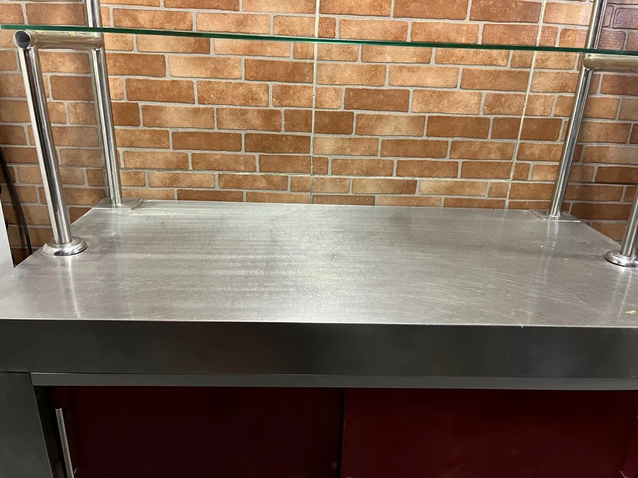 Stainless steel table with glass top, perfect for your business!