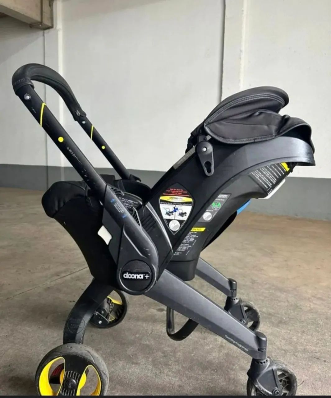 Bebê conforto com carrinho Doona