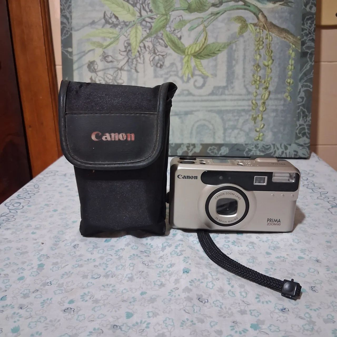 Câmera Canon prima zoom 60 com capa. 