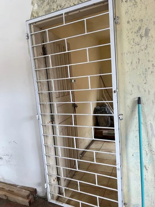 Grade de ferro com caxilio 