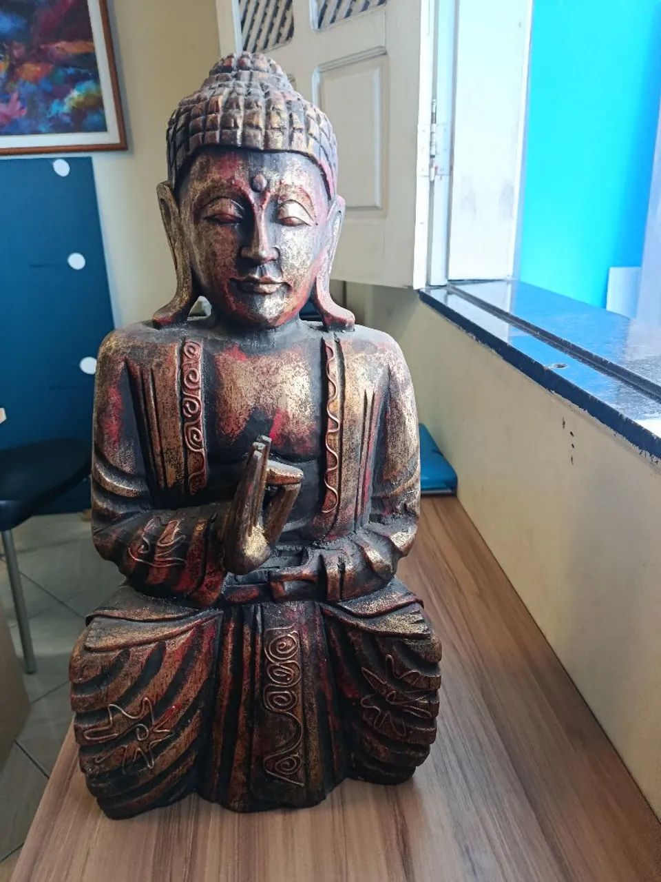 Buda em madeira 