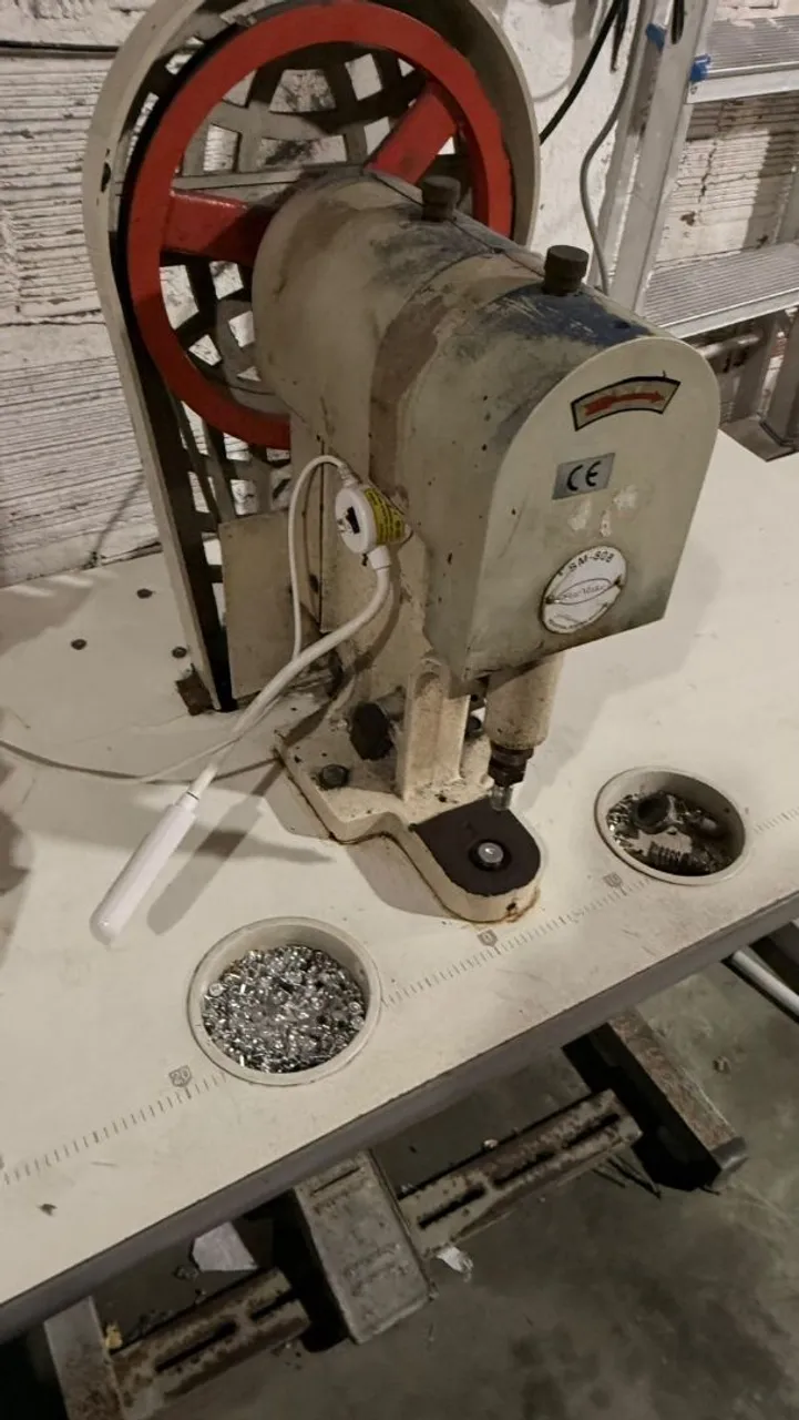 Máquina de botão