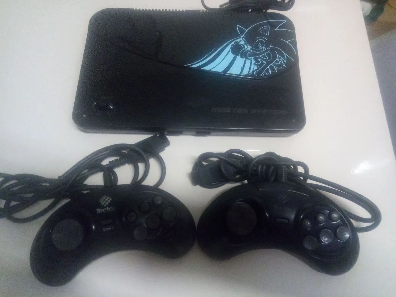 Master system funcionando perfeitamente com 132 jogos na memória vai com 2 controle 
