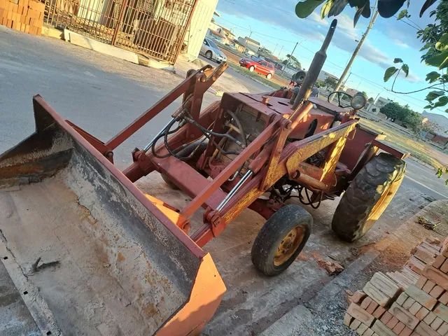 Vendo ou troca trator pula pula, pá carregadeira. 