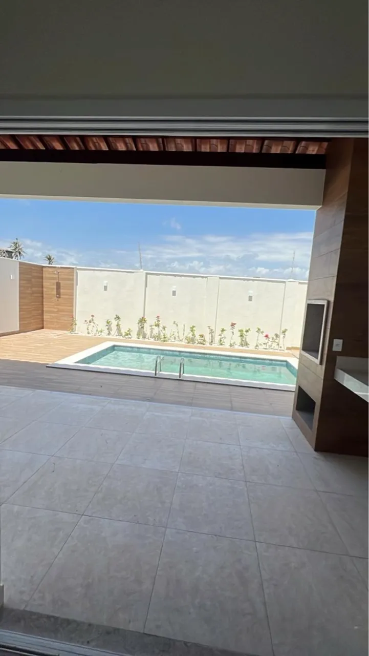 Casa de praia com piscina e em condomínio fechado