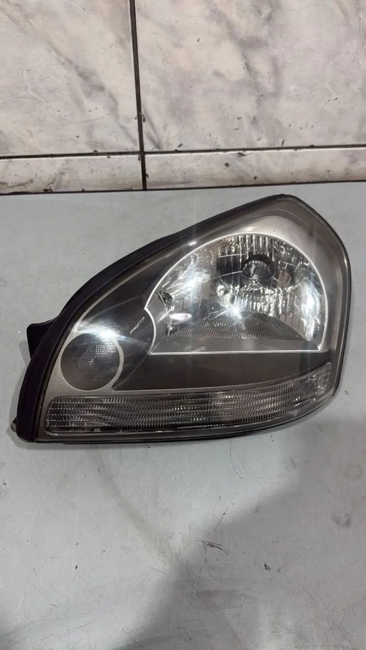 Farol esquerdo Tucson 2009 a 2015 