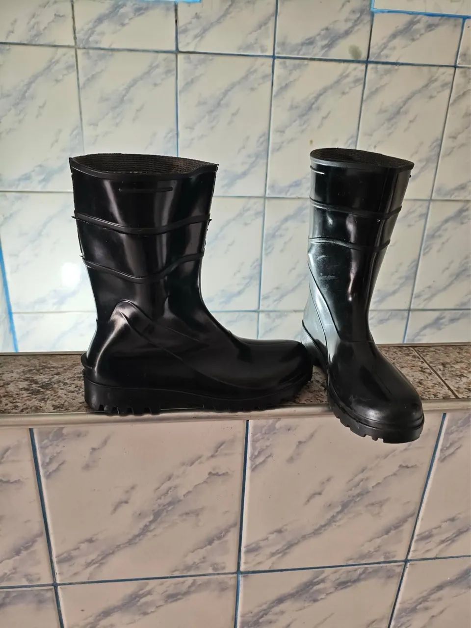 Selling medium-height PVC boots by Bracol.