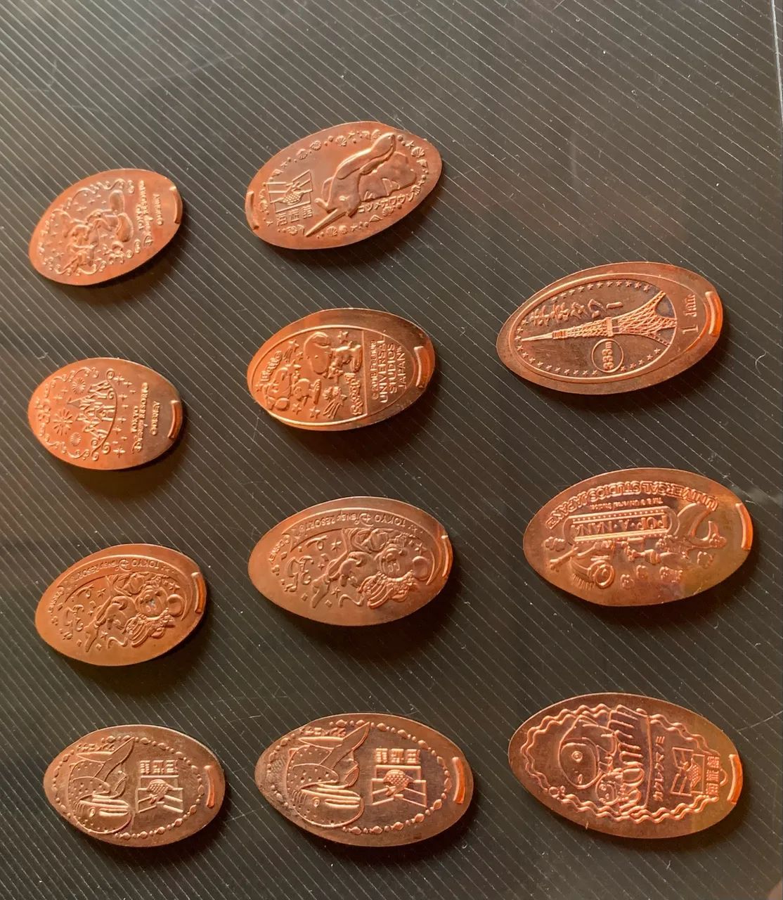 Lote de 11 moedas da Disney Tokyo