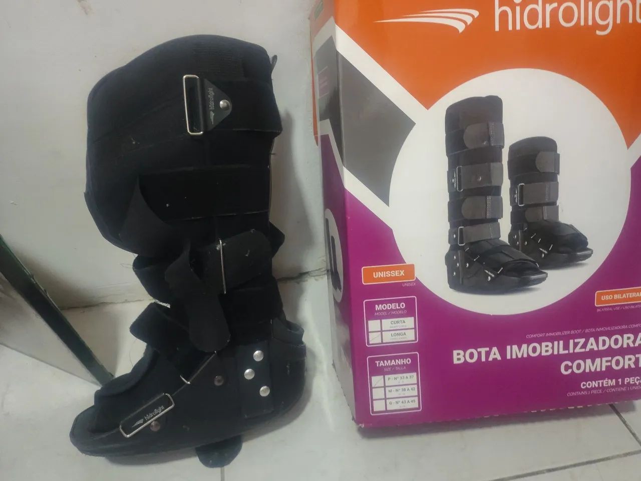 Bota ortopédica e tipóia 