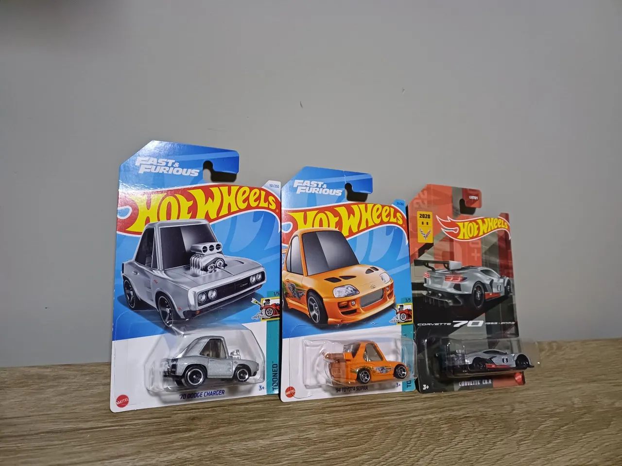 3 hotwheels 94 toyota supra tooned, 70 dodge charger, corvette c8 3 hotwheels 94 toyota supra tooned, 70 dodge charger, corvette c8