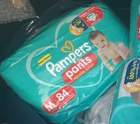 Fralda Pampers pants ajuste total 