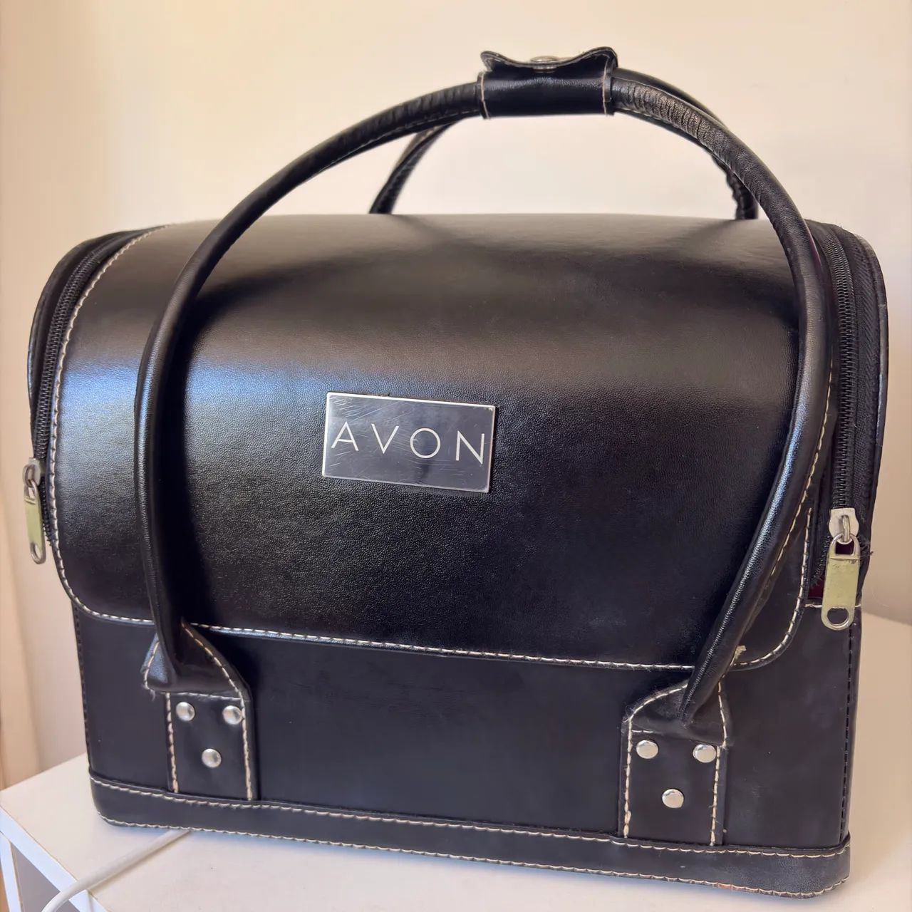 Maleta de maquiagem avon