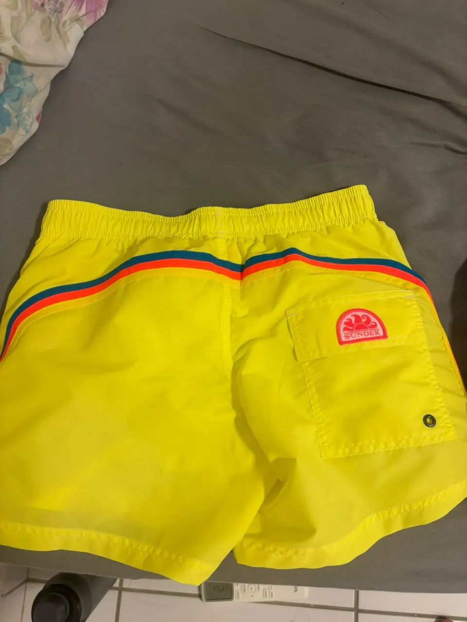 Sundek bolso e elástico 