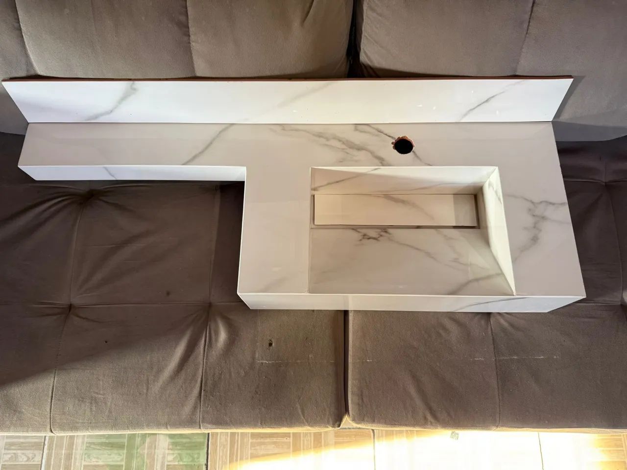 White veined porcelain sink with faucet