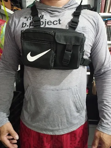 bolsa tipo colete com tres bolsos e uma divisoria