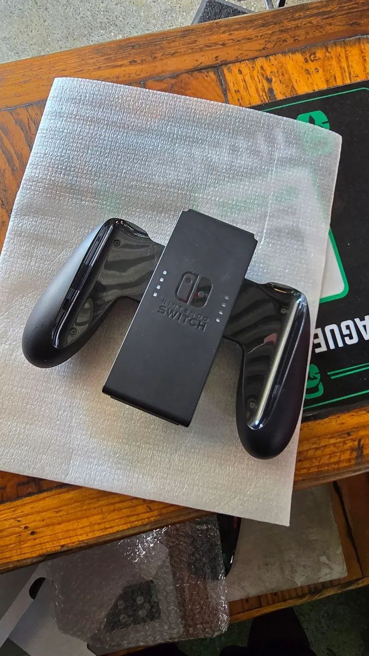 NINTENDO SWITCH OLED NA  CAIXA COM ACESSÓRIOS  - Foto 4