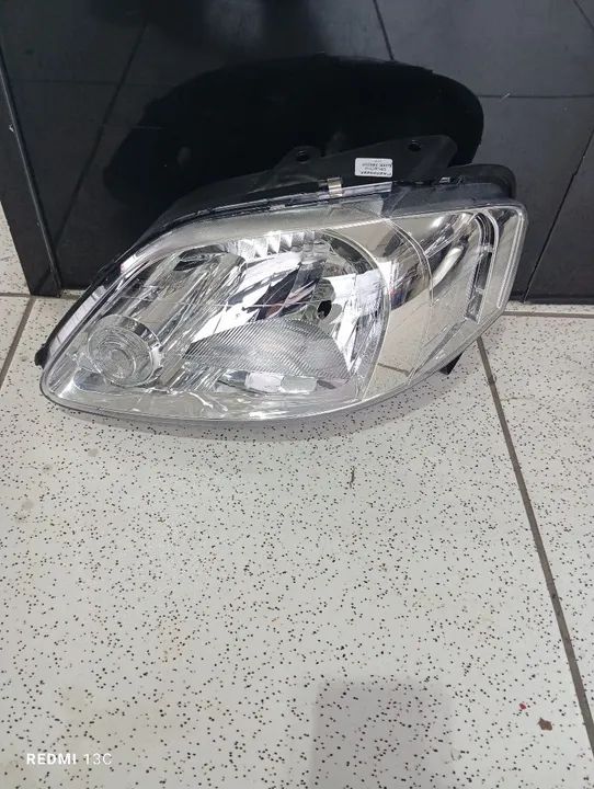 Farol Fox esquerdo simples 2003 a 2009