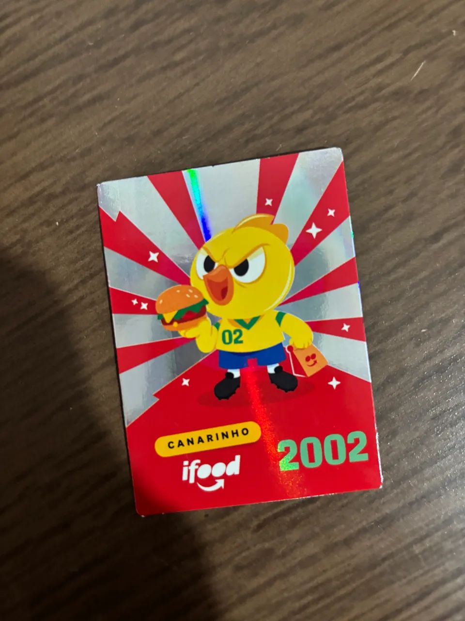 Figurinha ifood 2002 canarinho