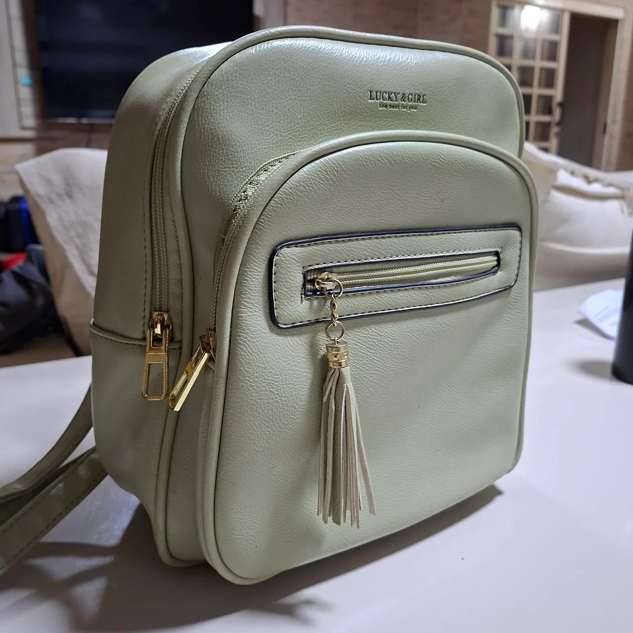 Mochila verde menta semi nova
