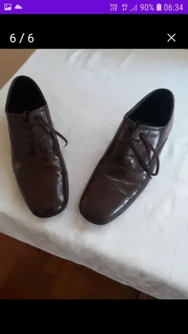 Sapato masculino número 39 tenho um marrom e outro preto pouco uso