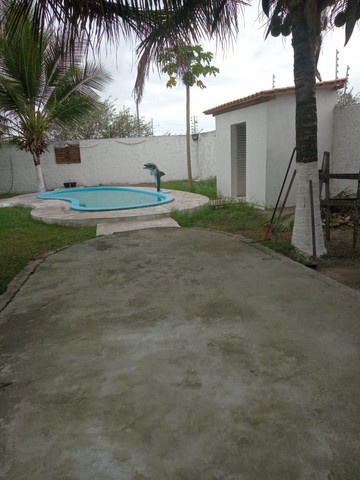Casa com piscina tipo chácara em condomínio fechado 