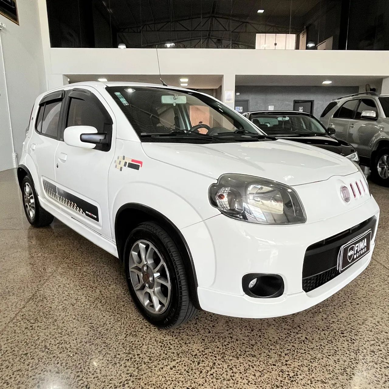Fiat Uno Sporting 1.4 EVO Fire Flex 8V 4P 2013 - Foto 3