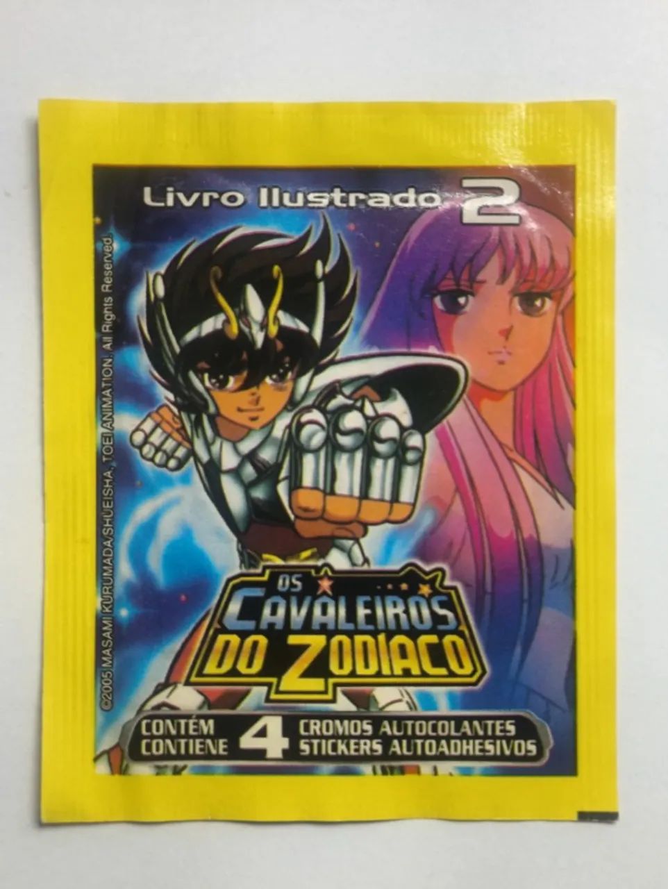 Kit 20 pacotinhos figurinhas Cavaleiros do Zodíaco - Livro