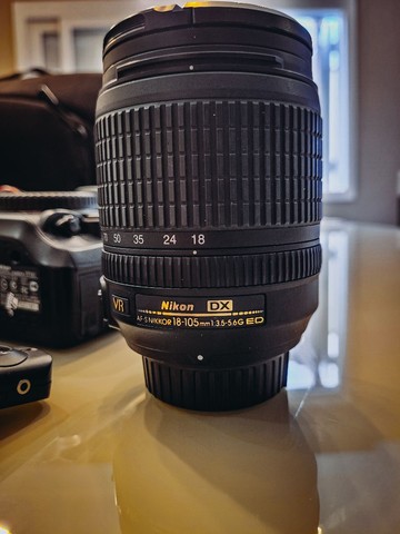 Camera Nikon D7100 + Lente 18-105mm + Acessórios.