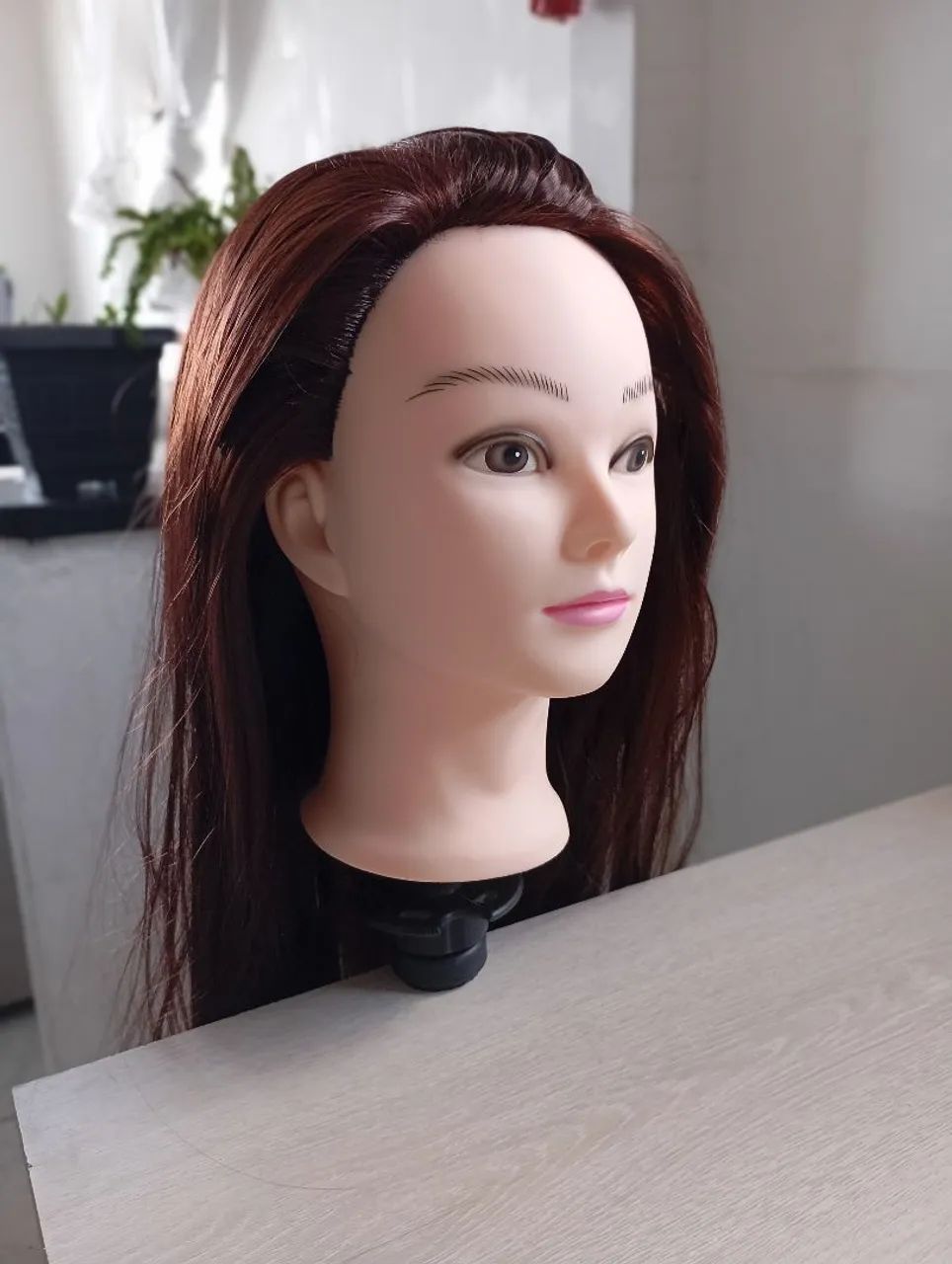 Cabeça de boneca para treino