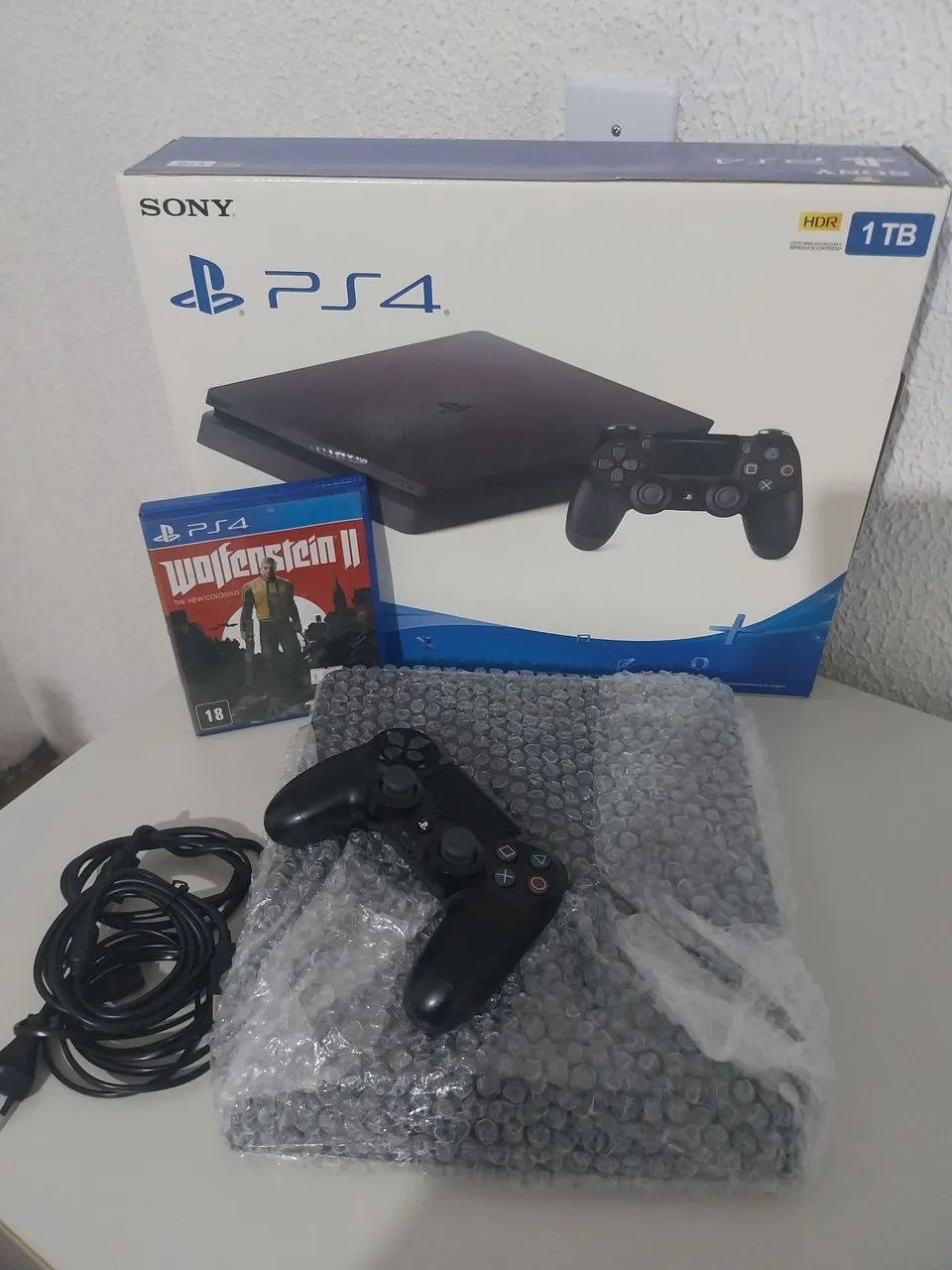 PS4 SLIM NA CAIXA 500 GB SEMI NOVO EM PERFEITO ESTADO + JOGO