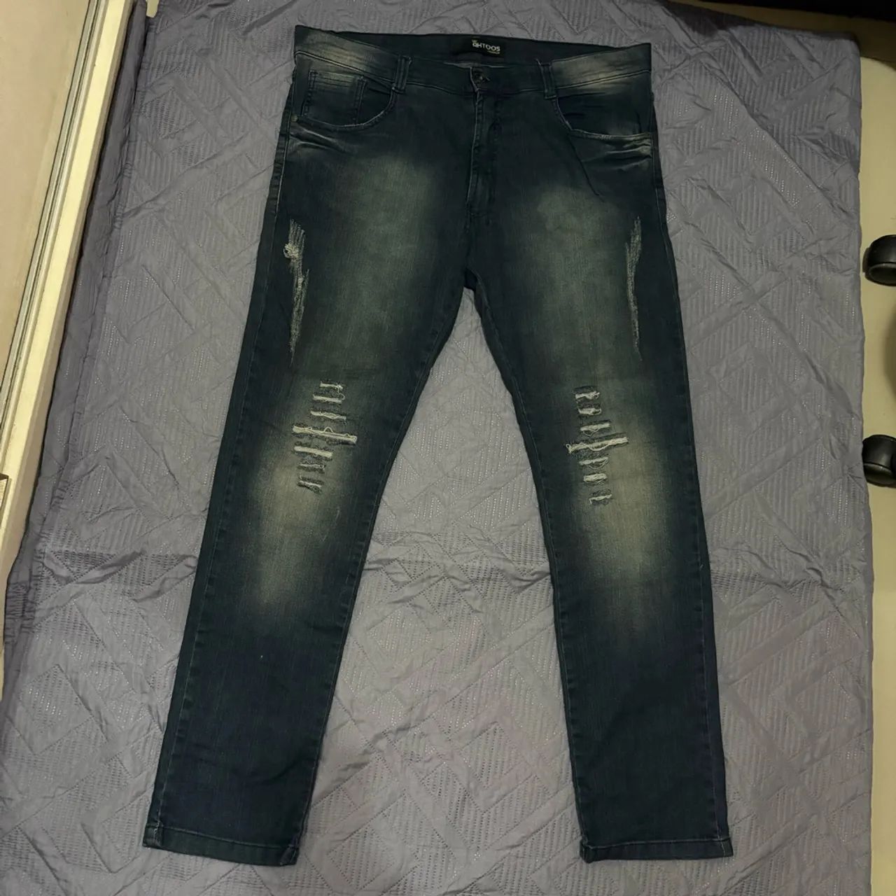 Calça jeans tam 48