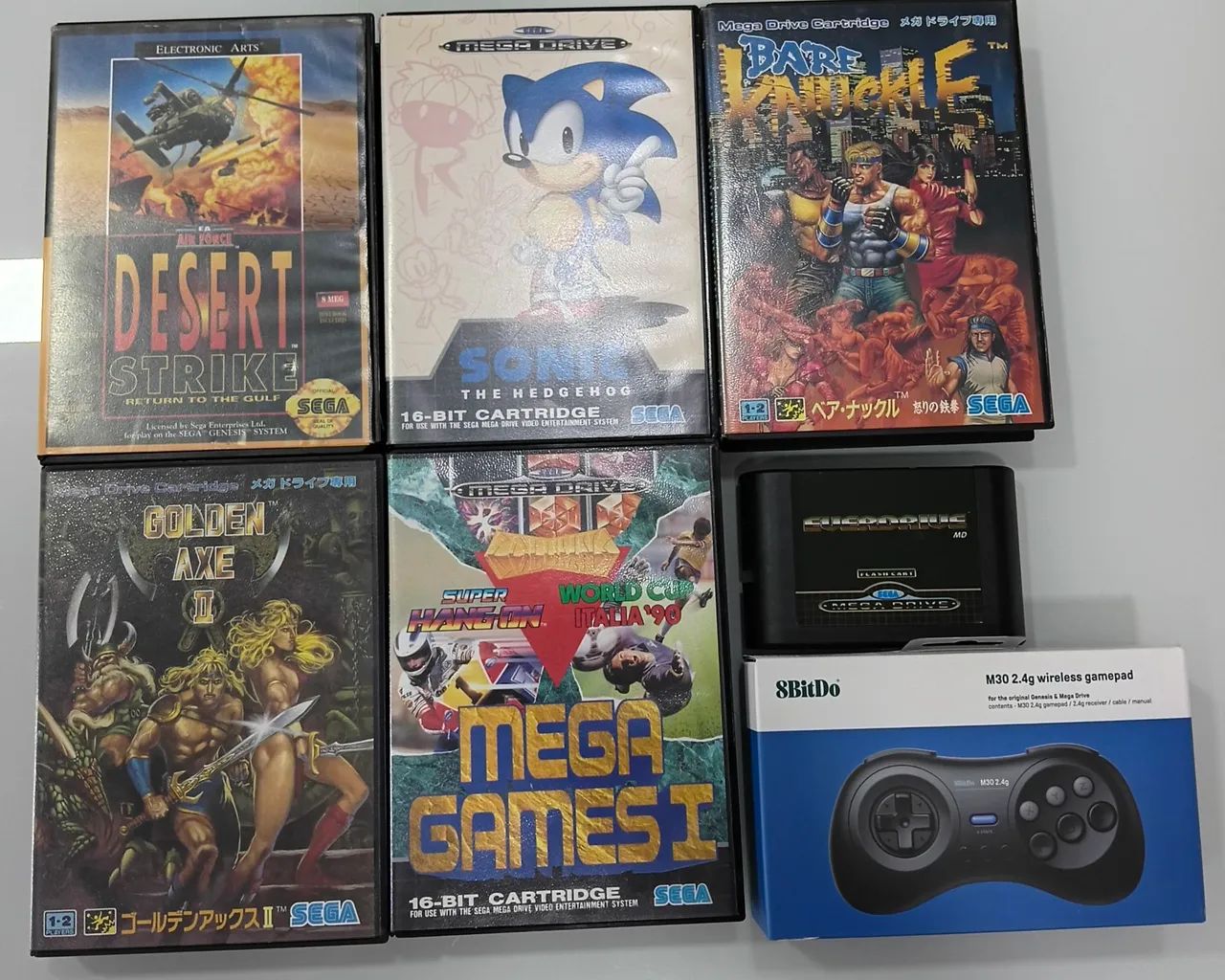 Cartuchos e joystick Mega Drive