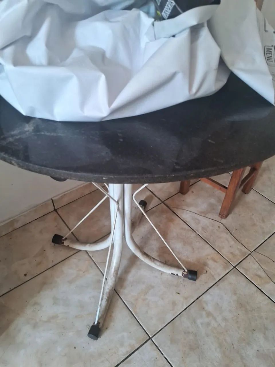 Kitchen table with marble top.471904570458122240