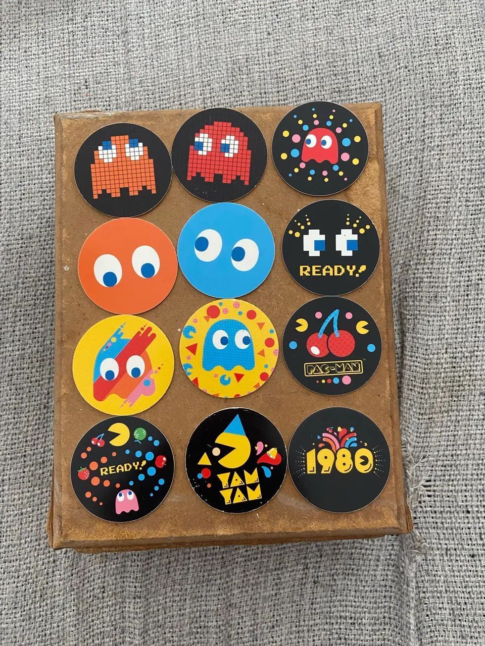 Coleção com 12 Tazos Pac Man Elma Chips