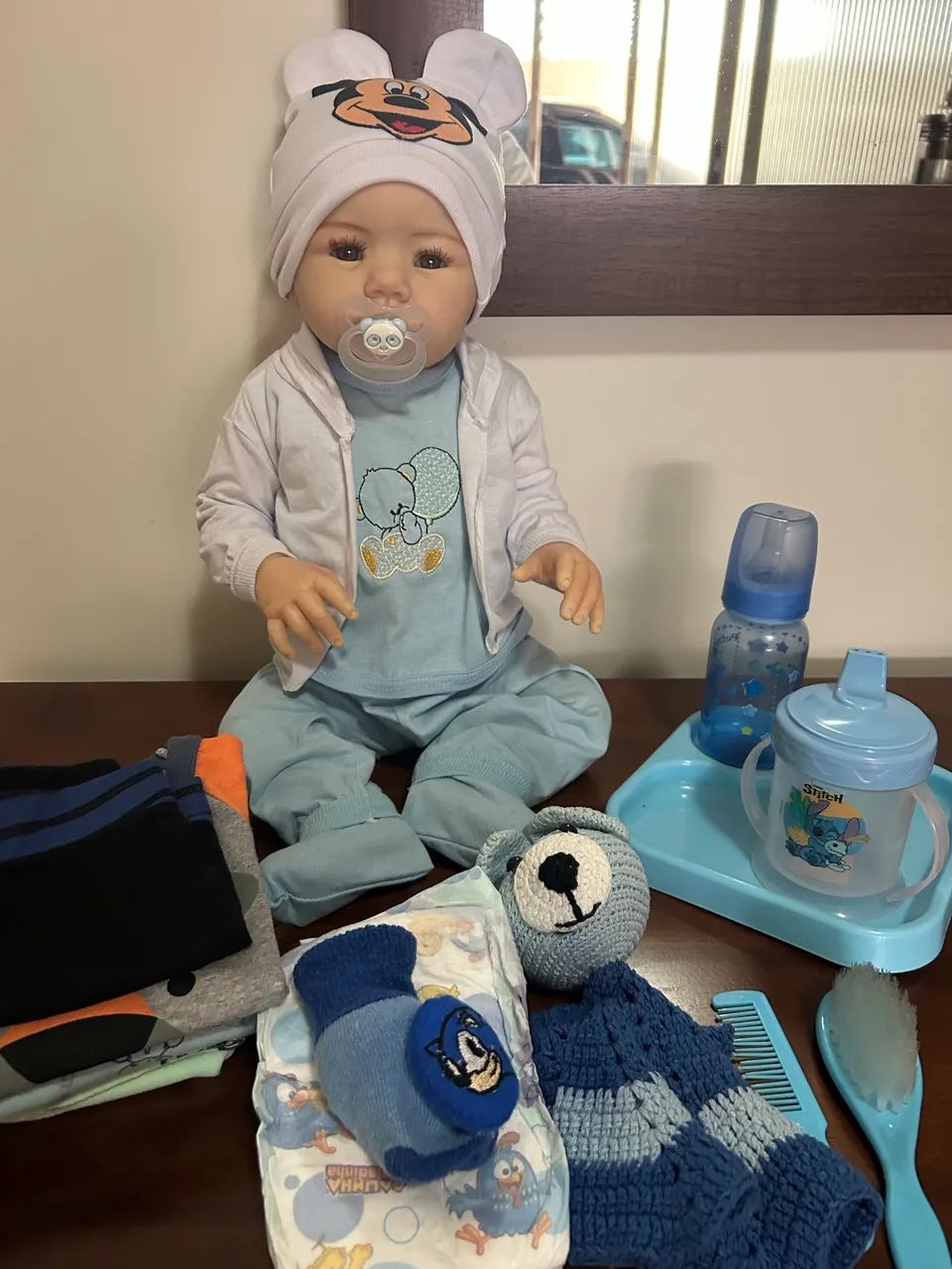 Boneco bebê reborn silicone com acessórios 
