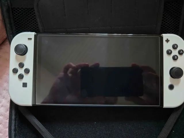 Nintendo Switch OLED branco, pouco uso, com película e case de transporte. - Foto 2