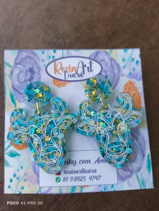 Brinco em resina boi da macuca