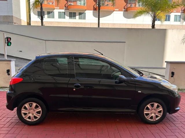 207 XR 1.4 flex 2011 2 pts Raridade só 90 mil KM Doc OK particular muito novo - Foto 2