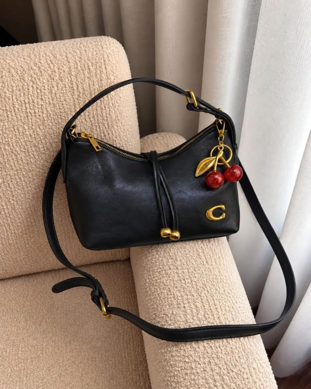 Bolsa Coach com chaveiro 