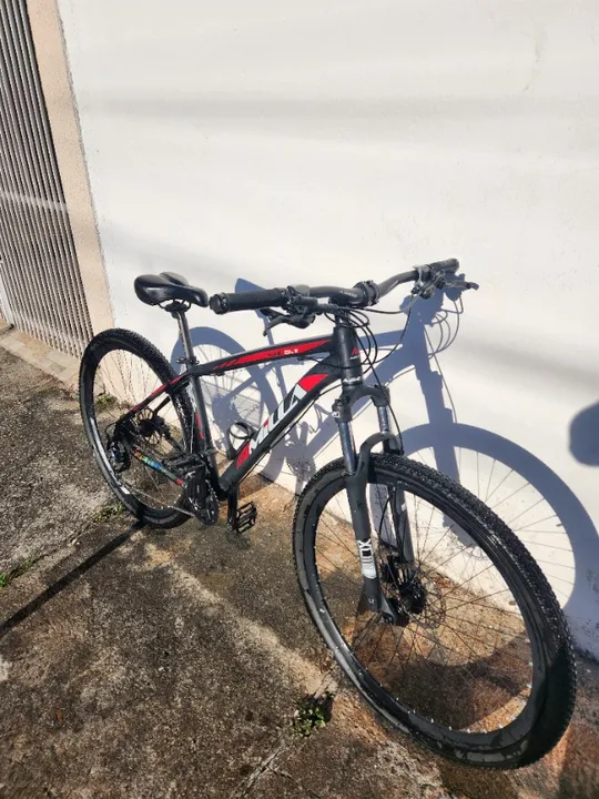 Bike 29 quadro 17 - Kit Shimano alívio 27 marchas / Freios a disco + equipamentos
