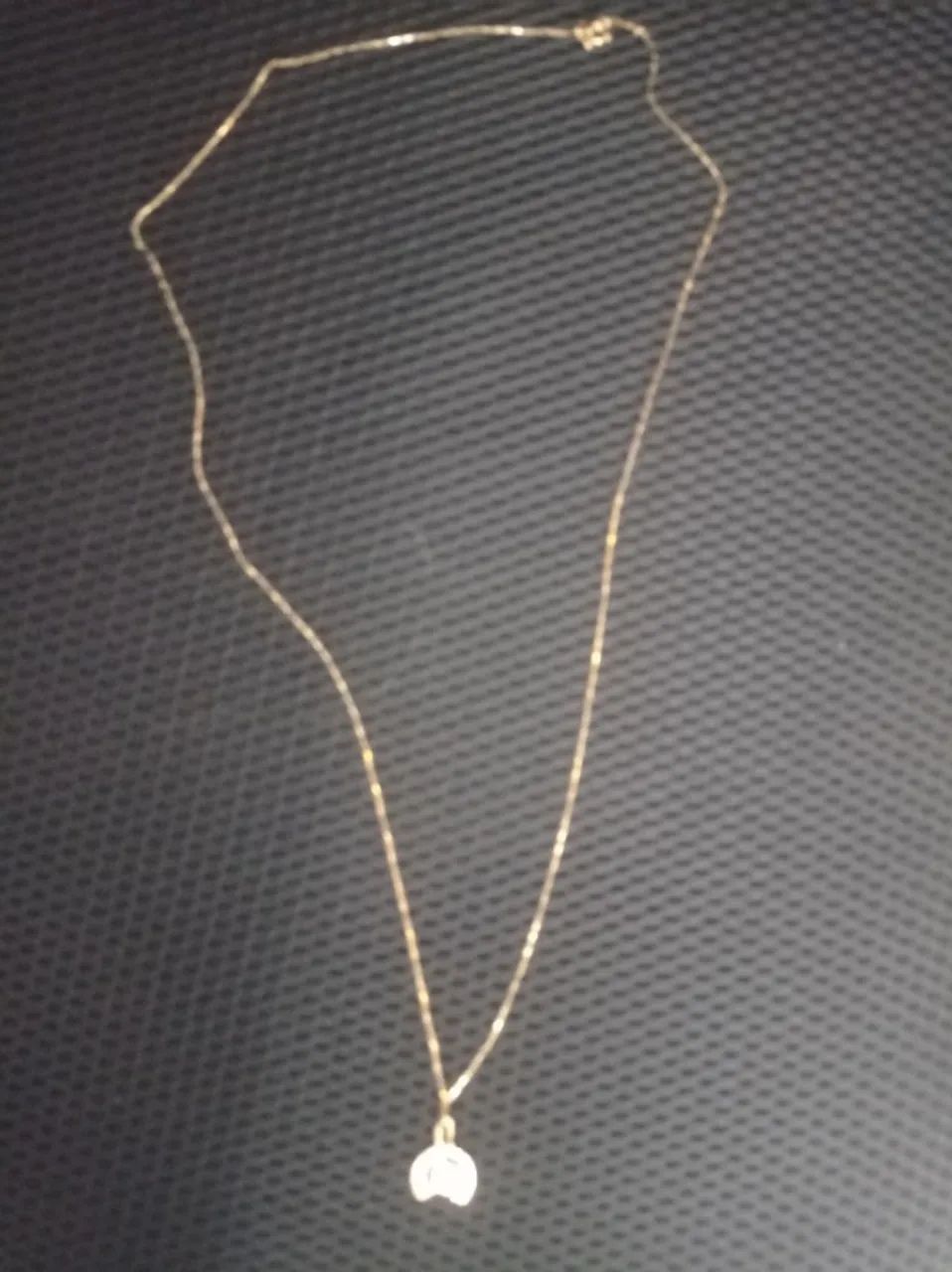 Corrente de ouro com pingente 