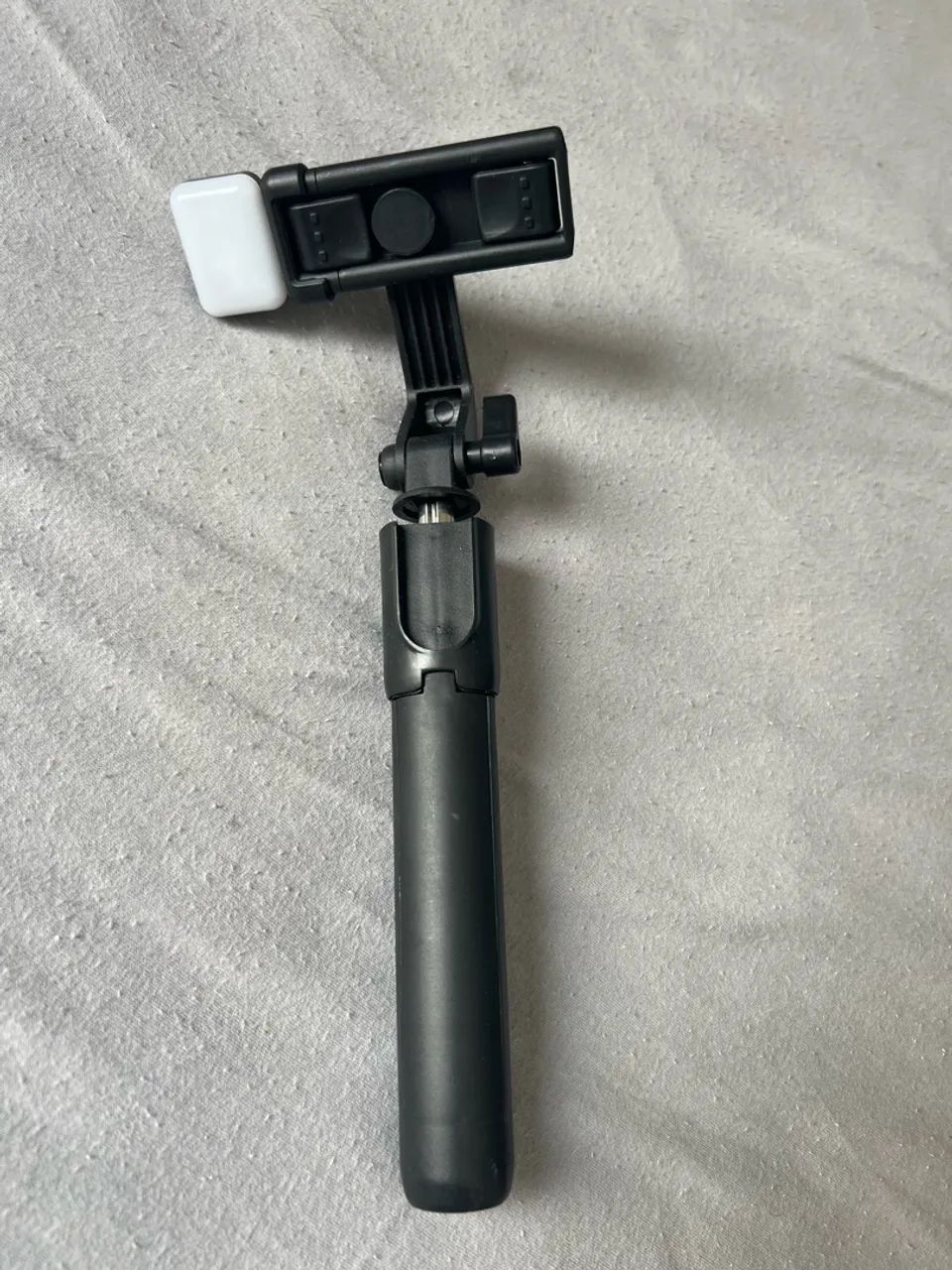 Bastão de self e gravação com iluminação 
