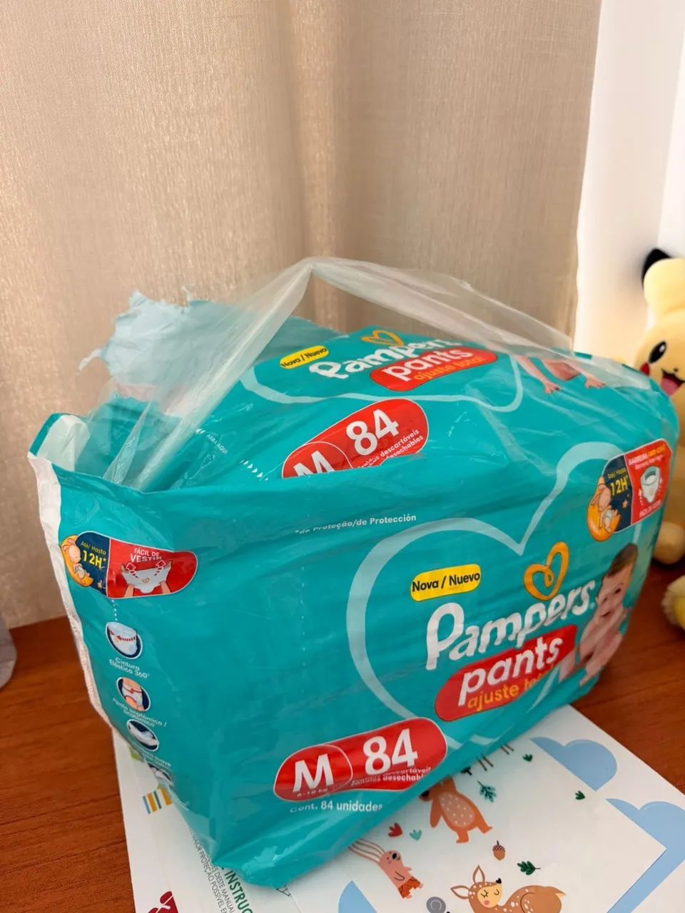 Fralda ABERTA pampers pants M com 68 un