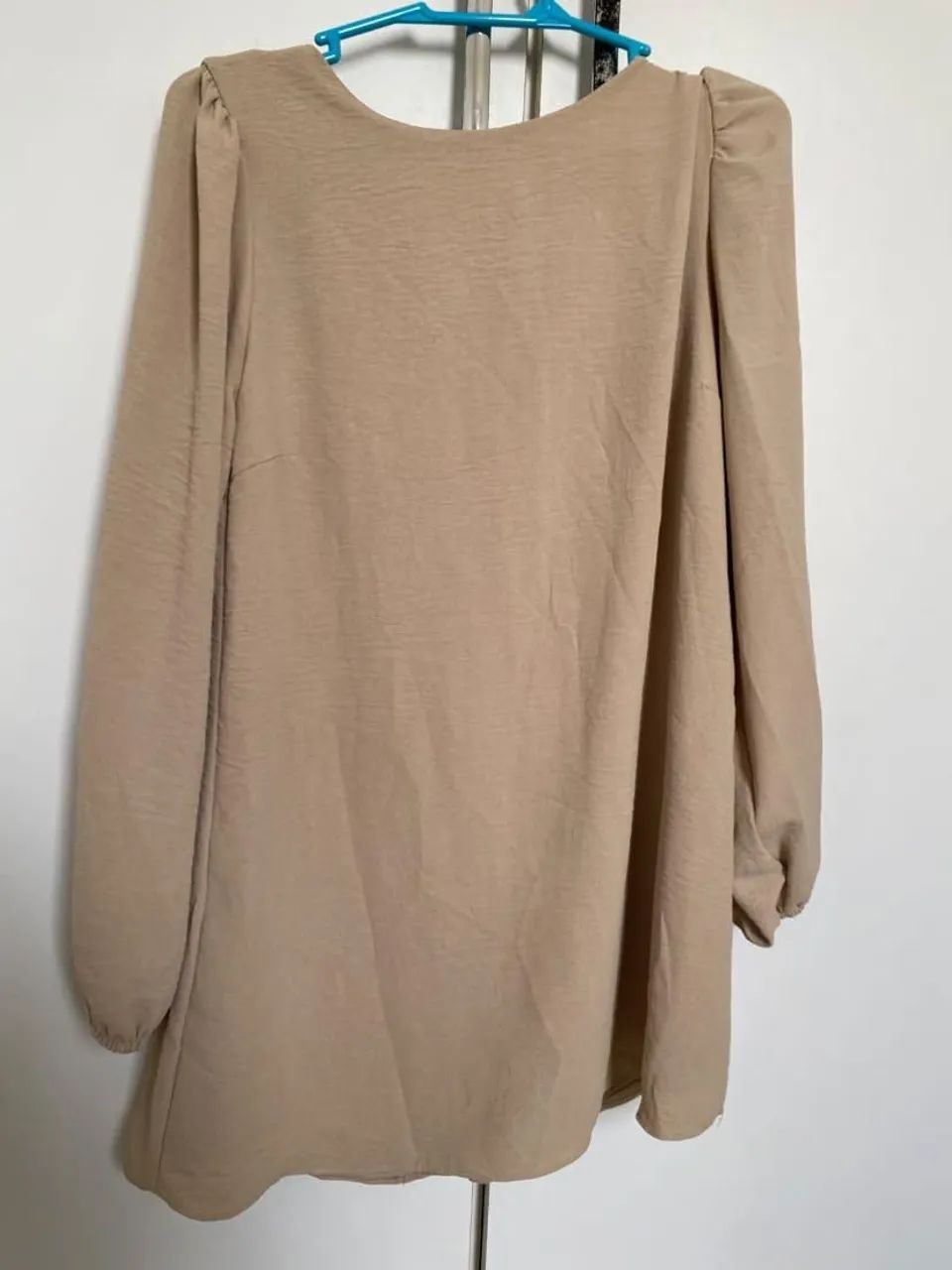 Vestido/short por baixo. Com manga