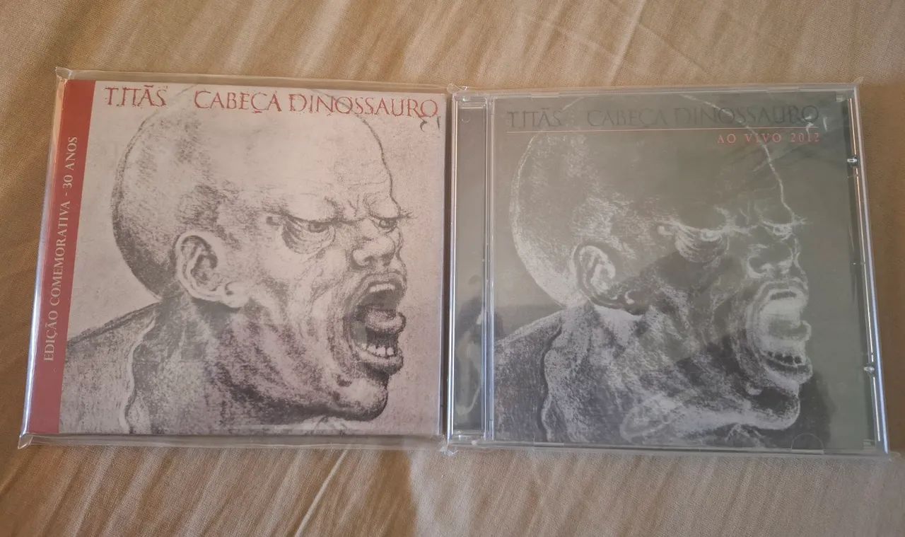 CDs Cabeça Dinossauro 