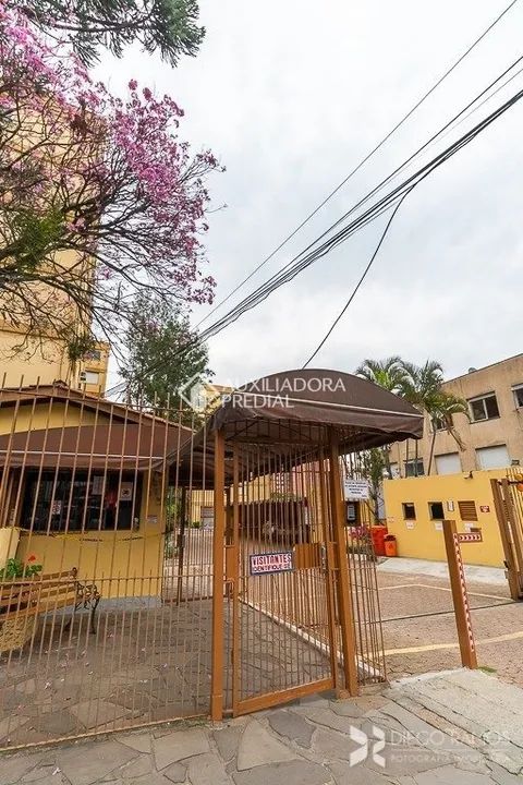 Apartamento de 3 dormitórios, living 2 ambientes, cozinha e área de serviço