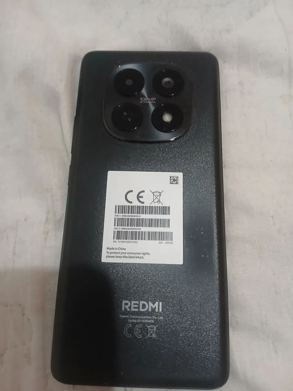 Vendo celular redimi note 15 semi novo 