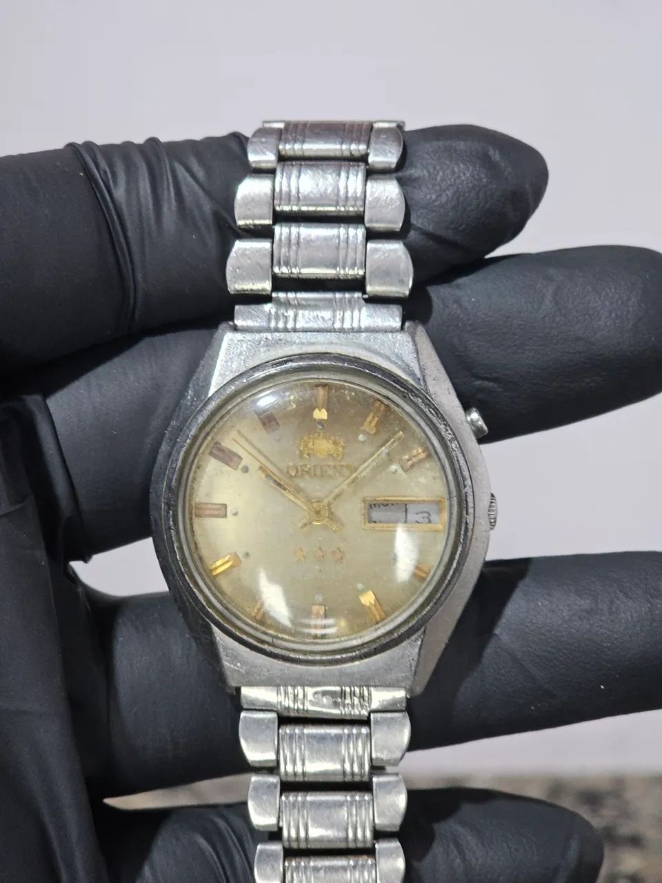 Relogio orient automatico com o mostrador maron 