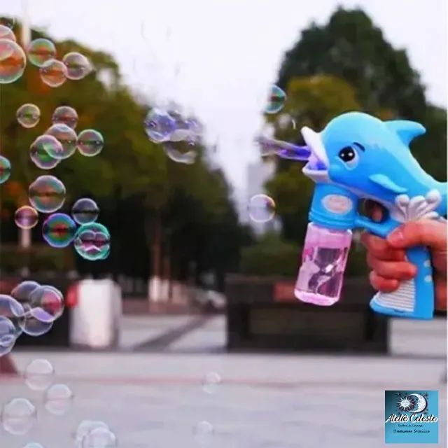 Brinquedo Lança Bolhas De Sabão C/ Led Pistola C/ Agua sabão à pilha com luz de led.